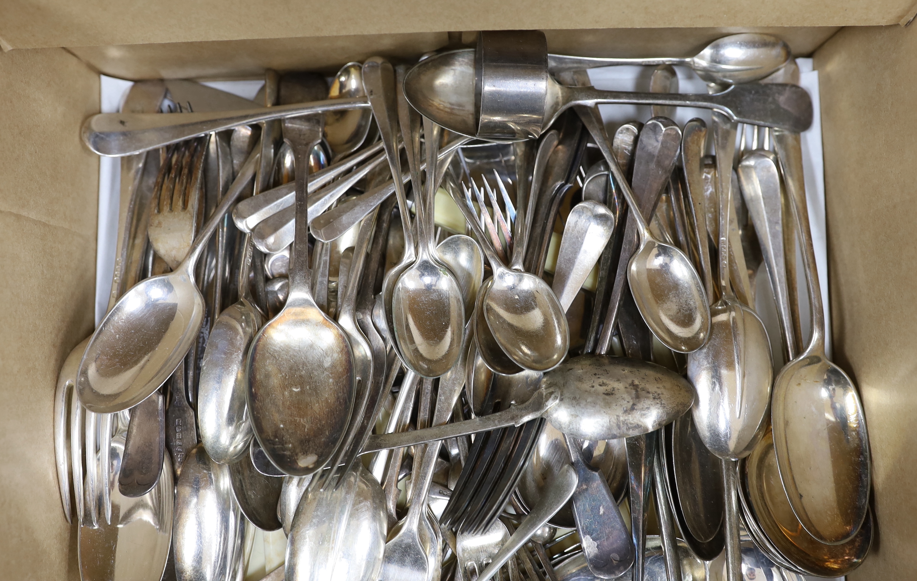 Three silver napkin rings, three silver spoons and a quantity of silver plated cutlery.